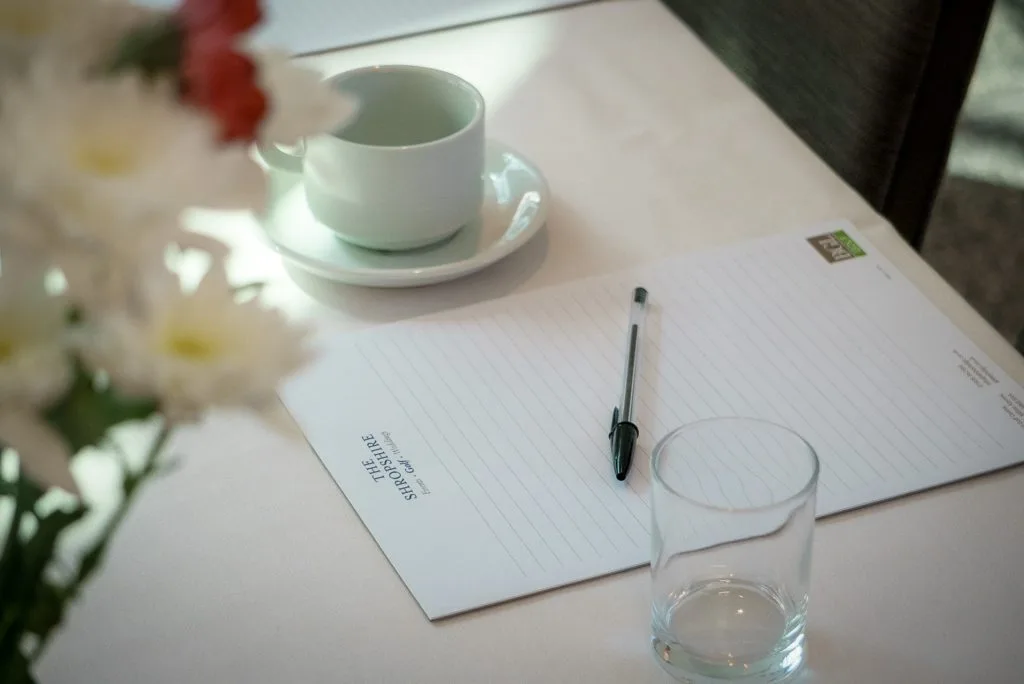 Notepad and pen on table at meeting room hire venue in Shropshire, ideal for corporate events and business meetings at The Shropshire
