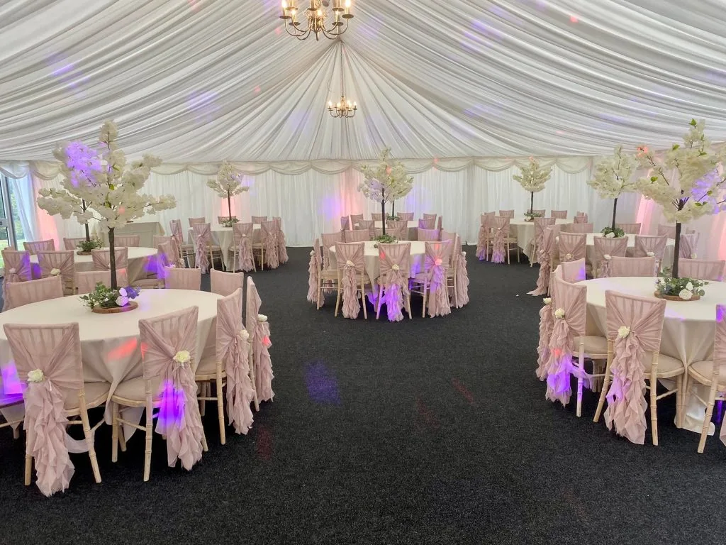 Elegant marquee with white draping set up for wedding ceremony at wedding venue in Telford, perfect for receptions and event hire
