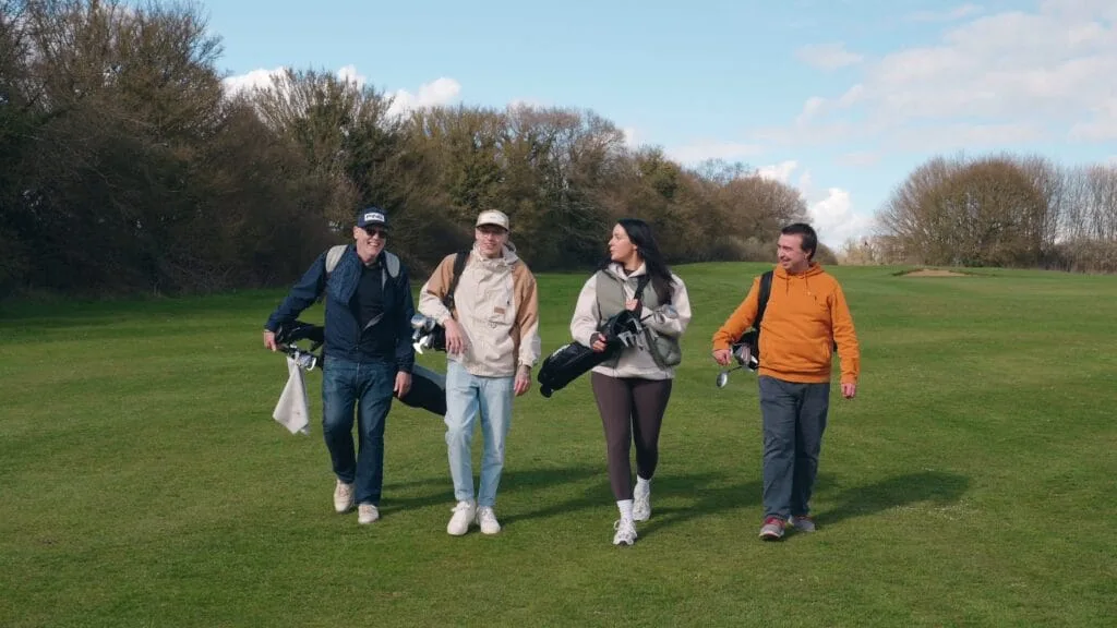 Golfers walking down the fairway on the 18 hole golf course at The Shropshire Golf Club in Telford, enjoying a golf day in Telford